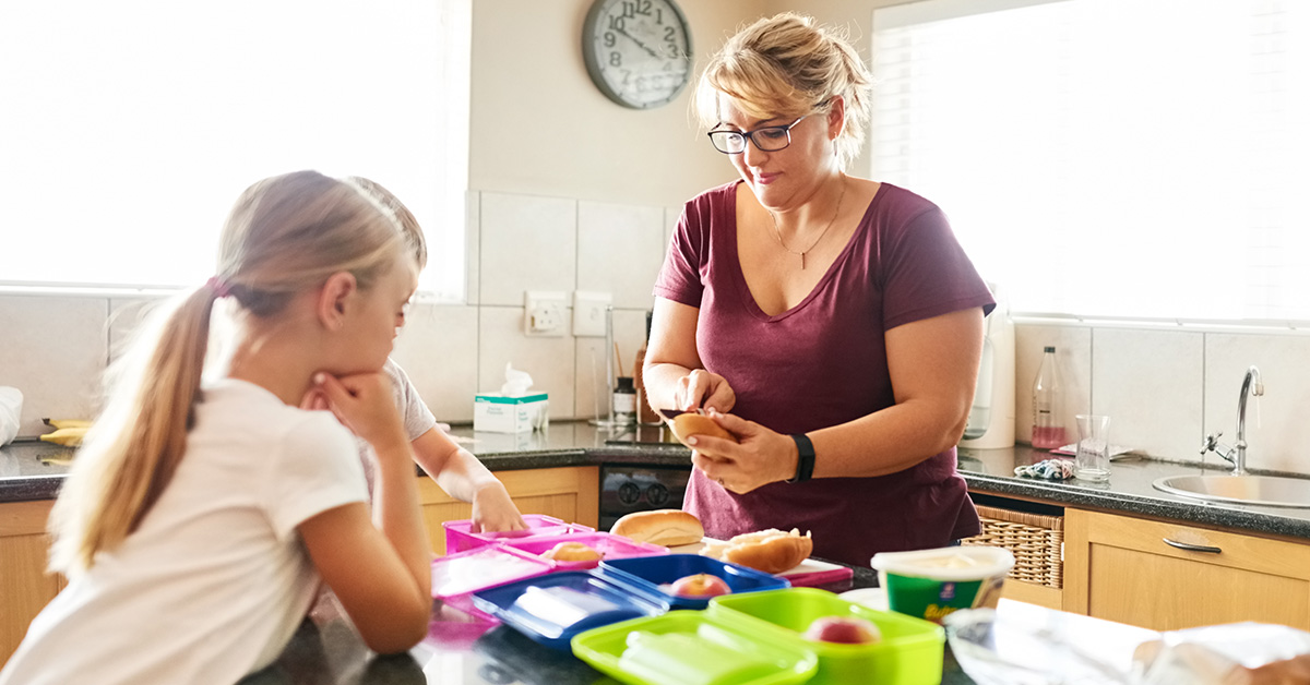 Mom preparing food for her daughter