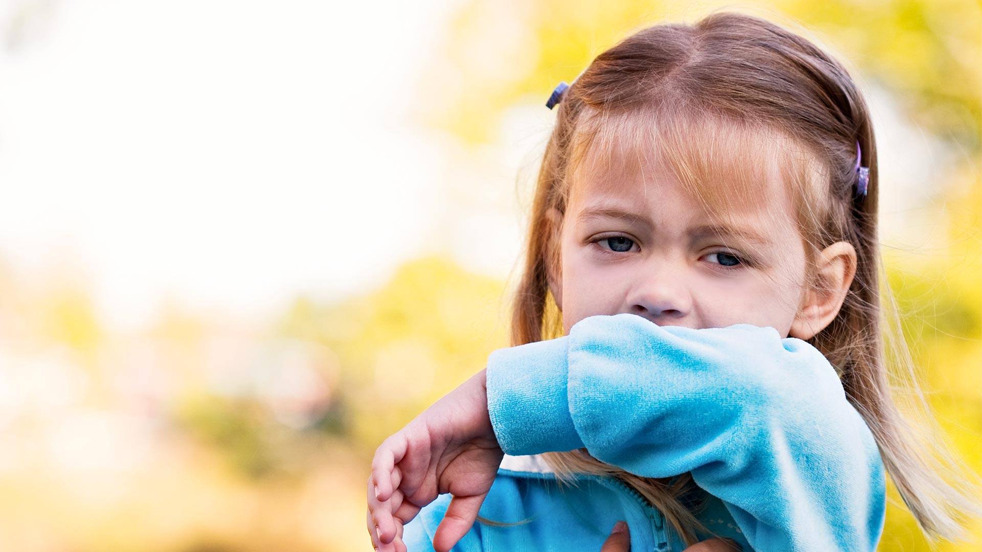 This sweet little girl shows the viewer the correct way to sneeze or cough by using the inside of her elbow and not her hands.