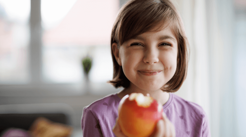 Girl holding an apple